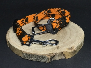 Palkar bezpečnostný pás do auta pre stredne veľké psy 55 cm x 20 mm čierno-oranžová s labkami
