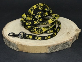 Palkar vodítko z popruhu pre psov 150 cm x 10 mm čierno-žltá s labkami