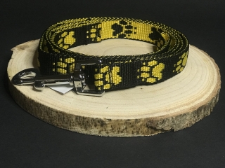 Palkar vodítko z popruhu pre psov 150 cm x 20 mm čierno-žltá s labkami