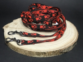 Palkar vodítko prepínacie z popruhu pre psov 250 cm x 10 mm čierno-červená s labkami