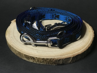 Palkar vodítko prepínacie z popruhu pre psov 250 cm x 16 mm čierno-modrá s labkami